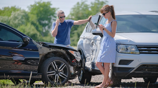 What to do after a minor car accident - Two people on the phone after a car crash