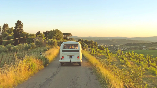 Best cars for road trips and camping – A van driving down a country road