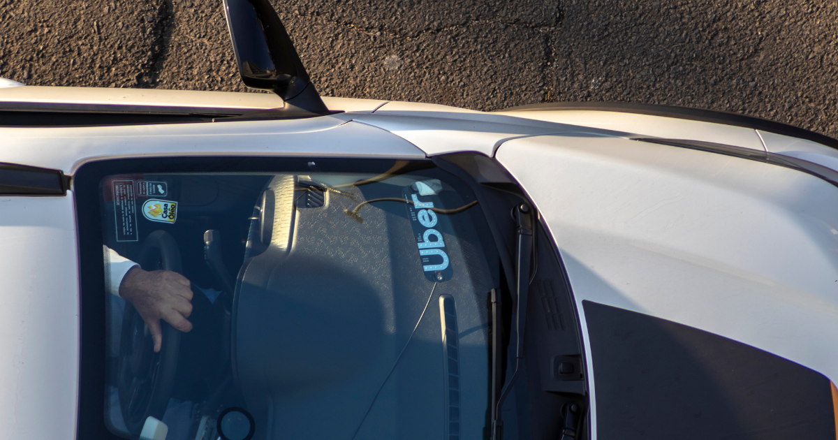 Birds eye view of a Tesla being used as an Uber, highlighting how useful having an Uber electric car is if you are becoming an Uber driver or looking at upgrading your car to an Uber EV